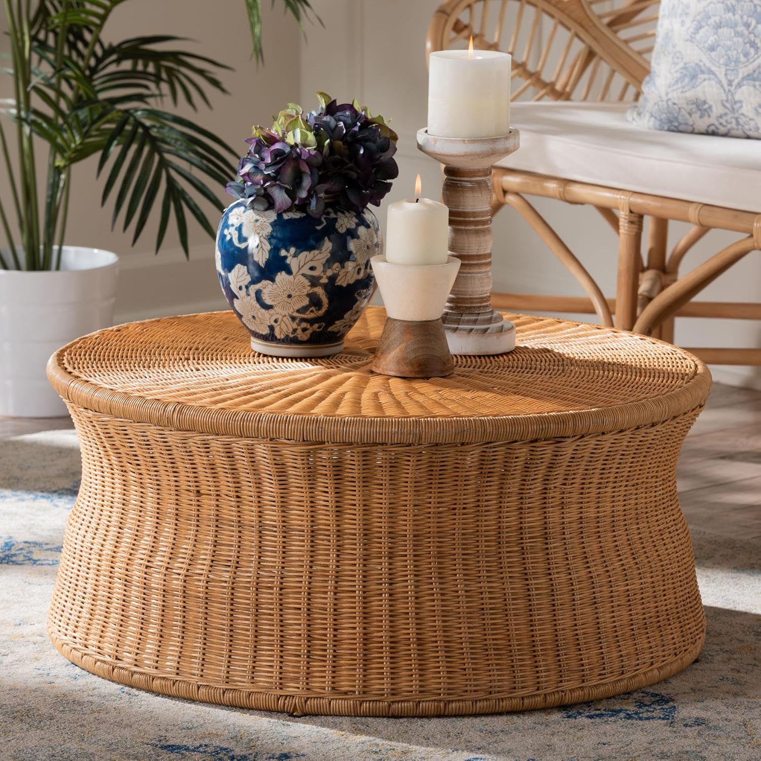 Round natural rattan coffee table in warm honey tone for boho interiors