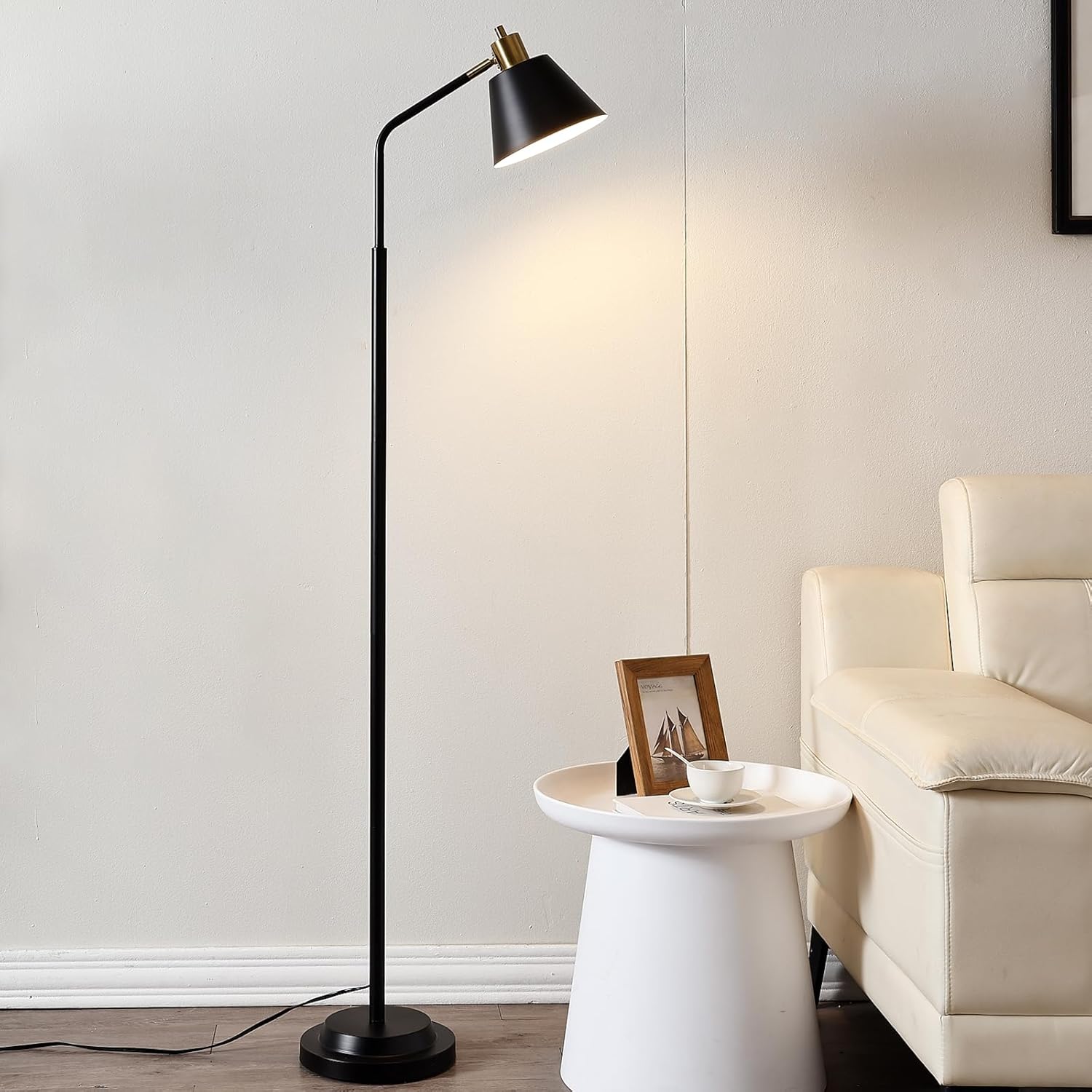 Black industrial floor lamp with adjustable head